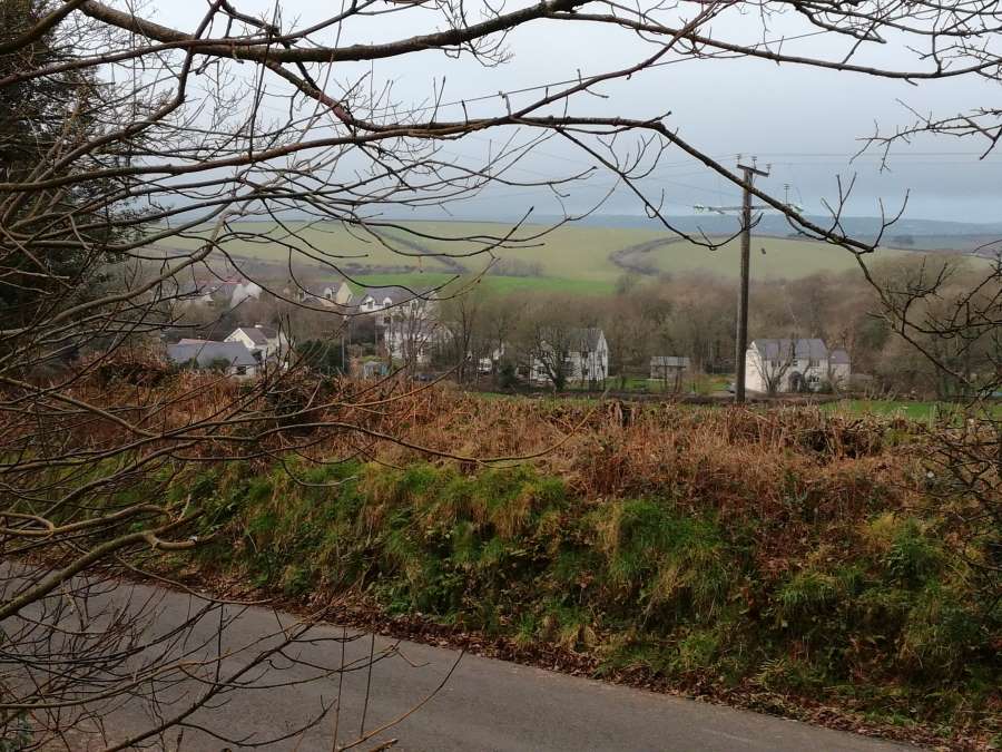 Looking down on Sutton village from the lane to Portfield Gate